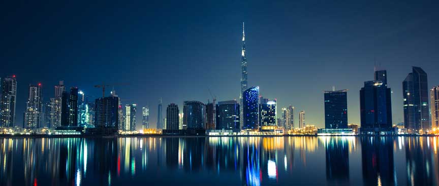 buildings in dubai nightlife surrounded by the sea